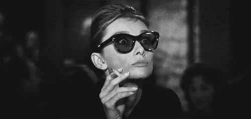 audrey_hepburn_pulling_down_sunglasses_in_breakfast_at_tiffany's_1961
