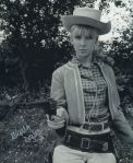 angela_douglas_pointing_pistol_in_carry_on_cowboy