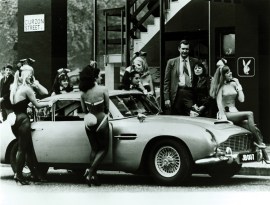 goldfinger_aston_martin_db5_flanked_by_1960s_playbunnies