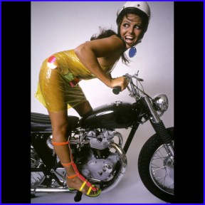claudia_cardinale_in_plastic_dress_on_motorbike