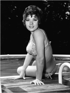 deborah_watling_on_edge_of_pool_in_bikini_1971