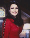 valerie_leon_smiling_in_red_blouse