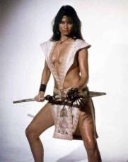 caroline_munro_posing_with_spear