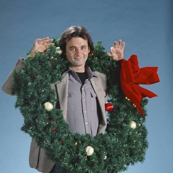 bill_murray_wearing_giant_holly_wreath_early_1980s